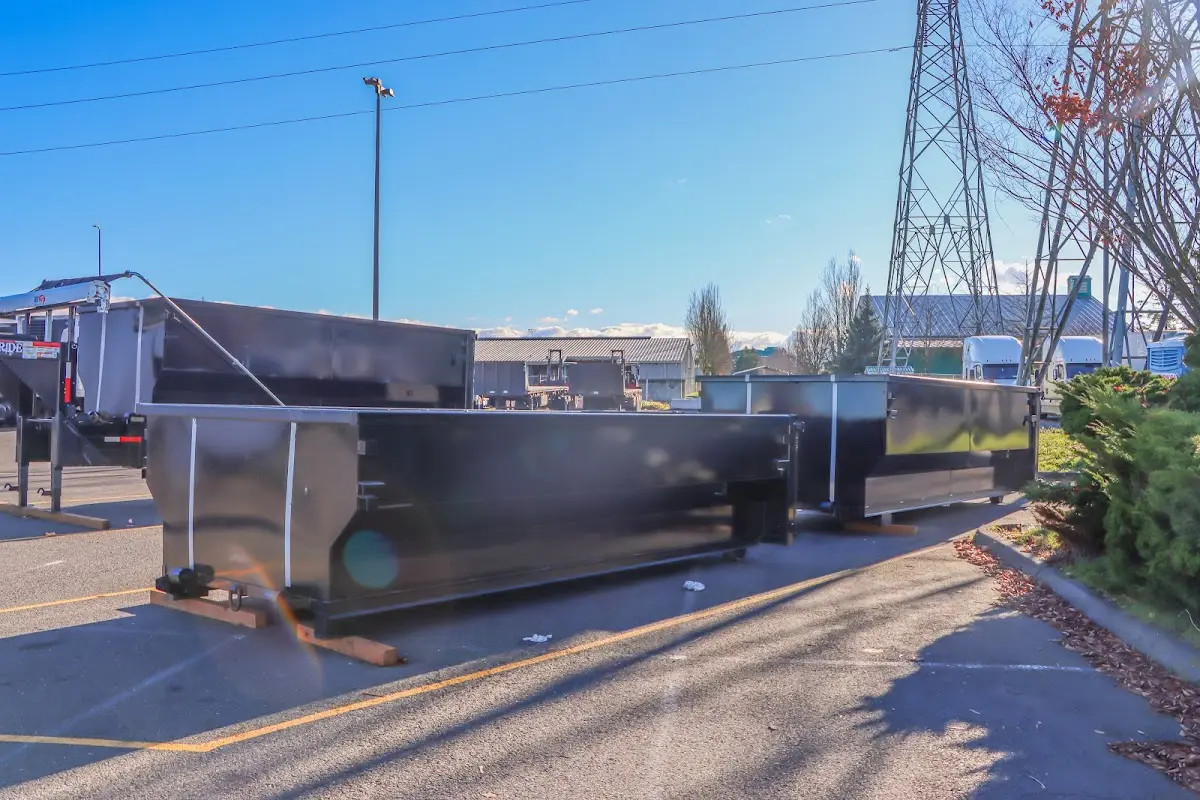 Roll-off dumpster ready for waste disposal at job site for Concrete Dumpster Rental in Madeira